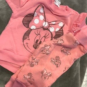 I’m selling a pink Minnie Mouse sweat suit.